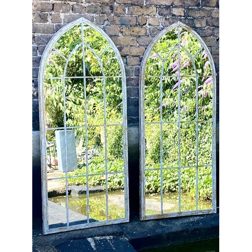 250 - ARCHITECTURAL GARDEN MIRRORS, a pair, 160cm H x 67cm W, arched metal frames. (2)