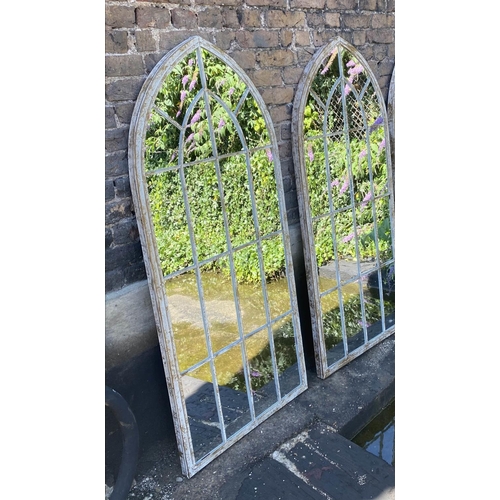 250 - ARCHITECTURAL GARDEN MIRRORS, a pair, 160cm H x 67cm W, arched metal frames. (2)