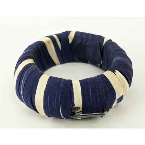 6 - AN OSCAR DE LA RENTA BLUE AND WHITE SILK OVERLAID BANGLE, together with an Emporio Armani black rope... 