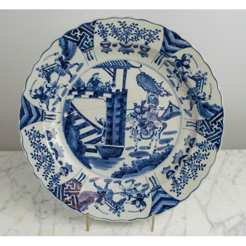 1 - CHINESE CHARGER, Kangxi style blue and white ceramic decorated with swordsmen a saddled warrior and ... 