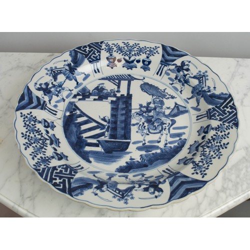 1 - CHINESE CHARGER, Kangxi style blue and white ceramic decorated with swordsmen a saddled warrior and ... 