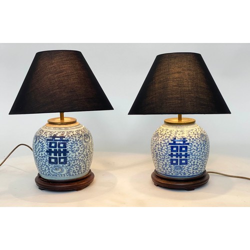 242 - TABLE LAMPS, a pair, Chinese blue and white ceramic of jar form with wooden bases, 48cm H. (2)