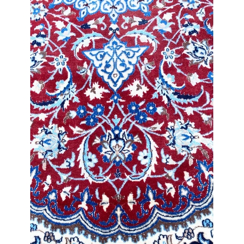 59 - PART SILK ISPHAHAN DESIGN CARPET, 246cm x 156cm.