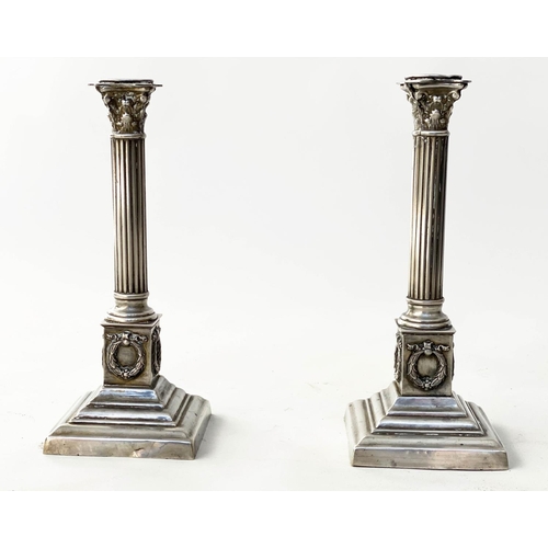 198 - CANDLESTICKS, a pair, 19th century silvered Corinthian capped, reeded column, wreath stepped weighte... 