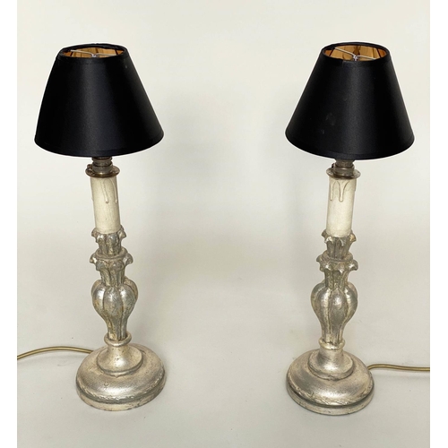 191 - TABLE LAMPS, a pair, Italian style carved silvered of candlestick form (with shades), 54cm H. (2)