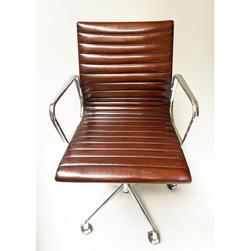 182 - REVOLVING DESK CHAIR, Charles and Ray Eames inspired with ribbed tan leather seat revolving and recl... 