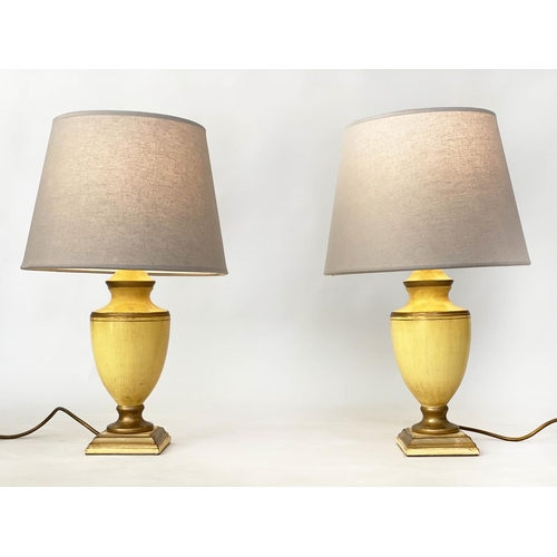 184 - TABLE LAMPS, a pair, antique yellow lacquered and gilt lined of vase form (with shades), 54cm H. (2)