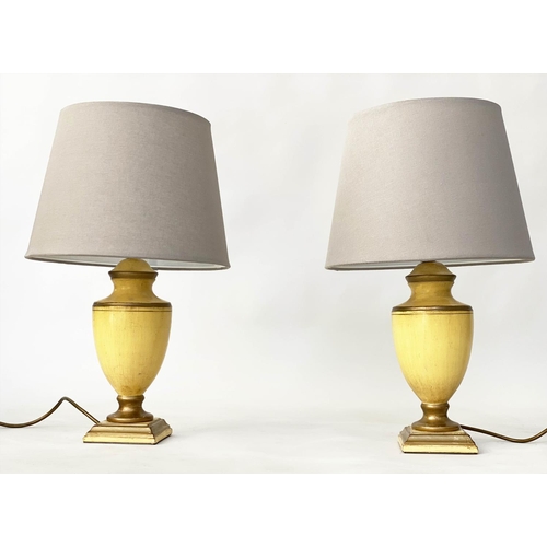 184 - TABLE LAMPS, a pair, antique yellow lacquered and gilt lined of vase form (with shades), 54cm H. (2)