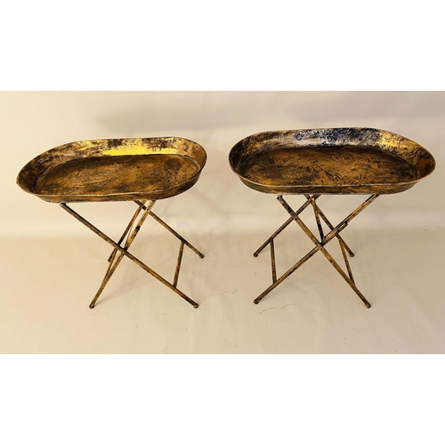 413 - TRAY TABLES, a pair, 66cm high, 68cm wide, 39cm, antiqued gilt metal finish. (2)