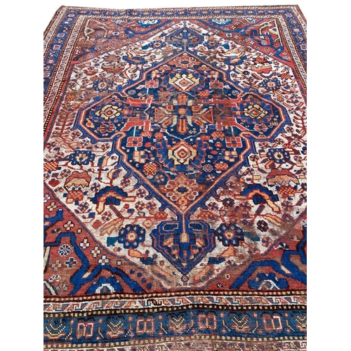 62 - ANTIQUE QASHQAI RUG, 187cm x 151cm.