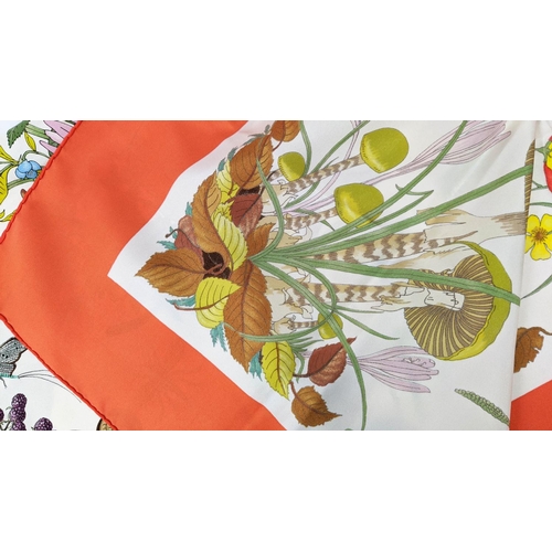 23 - VINTAGE GUCCI BOTANICAL MOTIF SILK SCARF, 86cm x 86cm, by Vittorio Accornero, with orange border.