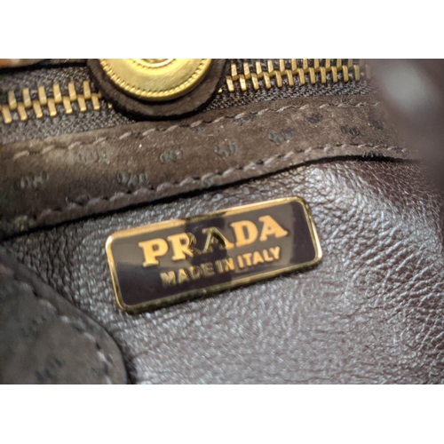 29 - PRADA BAG, wool hounds tooth body, brown suede handles, bottom base and trims with matching brown le... 