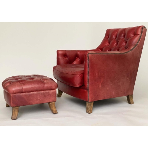 81 - ARMCHAIR AND STOOL, club style antique aged and brass studded scarlet leather upholstered with butto... 