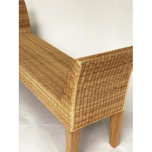 84 - WINDOW SEAT, rectangular cane woven with outswept arms and tapering square section supports, 148cm W... 