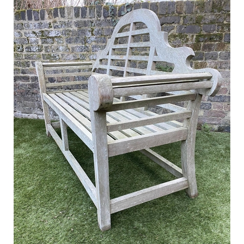 97 - LUTYENS STYLE GARDEN BENCH, weathered teak of slatted constructions after a design by Sir Edwin Luty... 