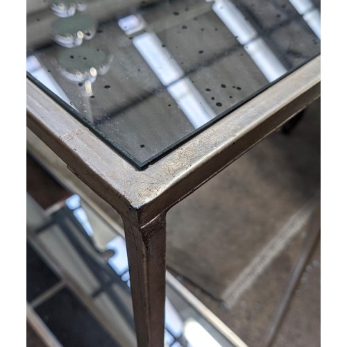 503 - CONSOLE TABLES, a pair, 137cm x 26cm x 80cm, silvered metal, antiqued mirrored tops and undertiers. ... 