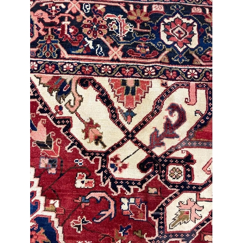 66 - ANTIQUE PERSIAN HERIZ SERAPI CARPET, 400cm x 283cm.