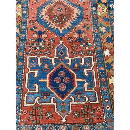 112 - ANTIQUE NORTH WEST PERSIAN RUNNER, 310cm x 95cm.