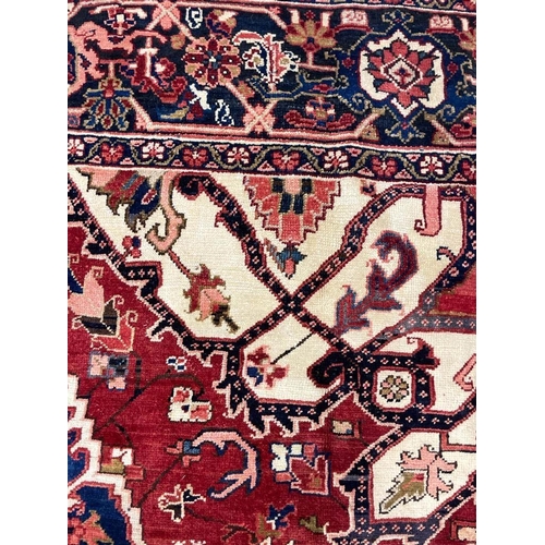 113 - ANTIQUE PERSIAN HERIZ SERAPI CARPET, 400cm x 283cm.