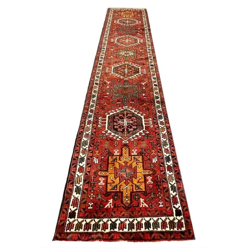 116 - PERSIAN KARAJA LONG RUNNER, 407cm x 75cm.