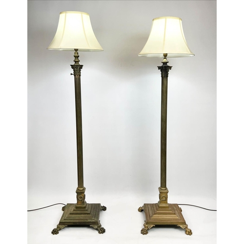 139 - COLUMN FLOOR LAMPS, a near pair, Victorian brass of Corinthian column design raised on paw feet with... 