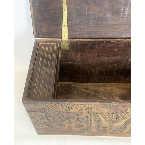 140 - ZANZIBAR TRUNK, 19th century hardwood and brass bound with rising lid, 57cm H x 116cm x 55cm.