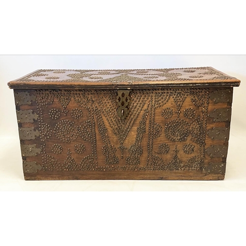 140 - ZANZIBAR TRUNK, 19th century hardwood and brass bound with rising lid, 57cm H x 116cm x 55cm.