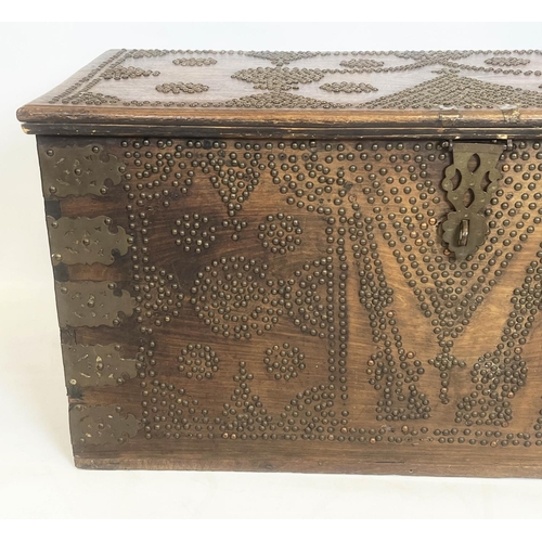 140 - ZANZIBAR TRUNK, 19th century hardwood and brass bound with rising lid, 57cm H x 116cm x 55cm.