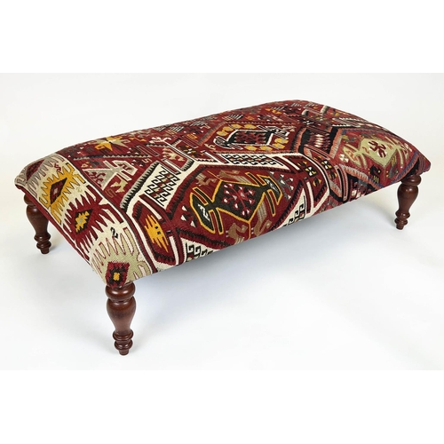 145 - KILIM FOOTSTOOL, Anatolian kilim upholstered with turned supports, 30cm H x 113cm x 62cm.