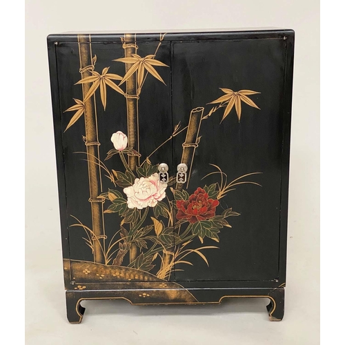 165 - CHINESE SIDE CABINET, black lacquered and gilt Chinoiserie and bamboo palm decorated with two doors,... 