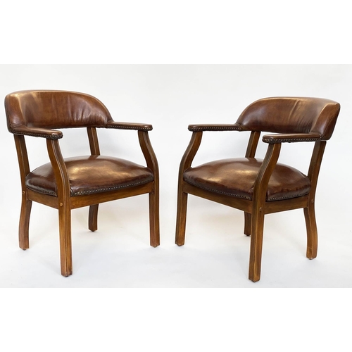 232 - LIBRARY ARMCHAIRS, a pair, walnut and studded mid tan leather each with curved back, 62cm W. (2)