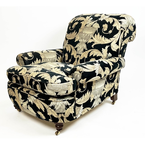 267 - HOWARD STYLE ARMCHAIR, upholstered in Versace style fabric with turned front supports and castors, 8... 