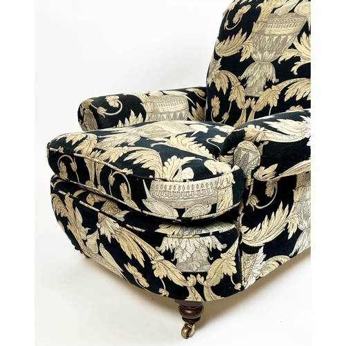 267 - HOWARD STYLE ARMCHAIR, upholstered in Versace style fabric with turned front supports and castors, 8... 