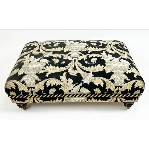 268 - FOOTSTOOL, upholstered in Versace style fabric with turned supports and castors, 112cm x 80cm x 41cm... 