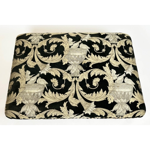 268 - FOOTSTOOL, upholstered in Versace style fabric with turned supports and castors, 112cm x 80cm x 41cm... 