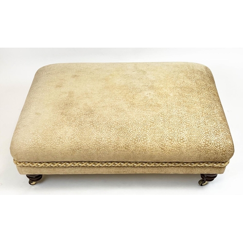 269 - FOOTSTOOL, upholstered in Versace style fabric with turned supports and castors, 112cm x 80cm x 41cm... 