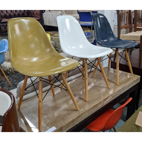 326 - AFTER CHARLES AND RAY EAMES DSW STYLE CHAIRS, a set of four, differing colours, 80cm H. (4)