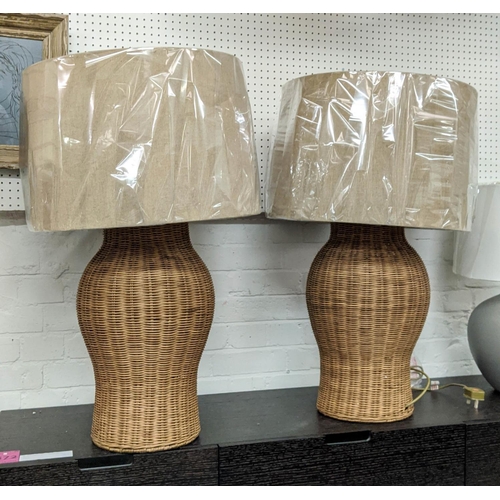 423 - PAOLO MOSCHINO LARGE RATTAN URN TABLE LAMPS, a pair, with shades, 81cm H. (2)