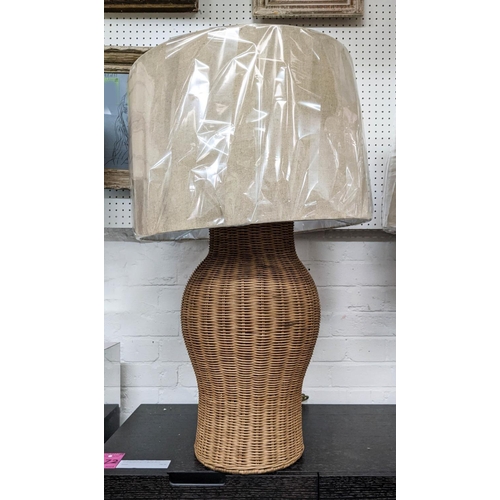 423 - PAOLO MOSCHINO LARGE RATTAN URN TABLE LAMPS, a pair, with shades, 81cm H. (2)