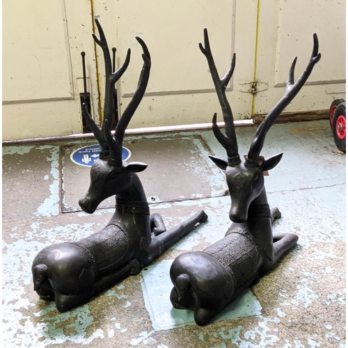 455 - RECUMBENT STAGS, a pair, perdu cast bronze, 80cm H.