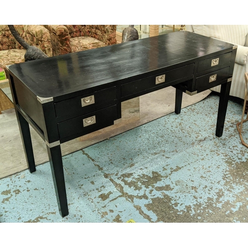 470 - DESK, 144cm x 55cm x 78cm, campaign inspired design, ebonised finish with one long draw flanked by t... 