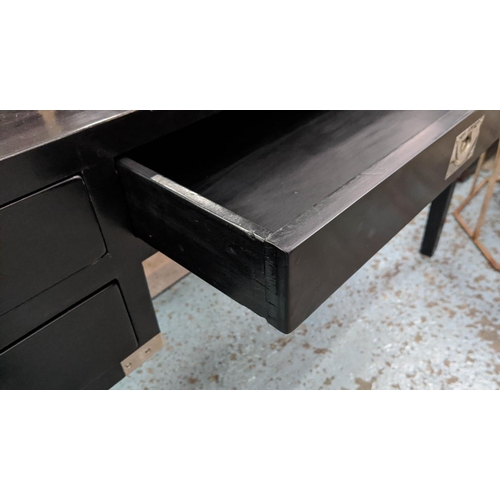 470 - DESK, 144cm x 55cm x 78cm, campaign inspired design, ebonised finish with one long draw flanked by t... 