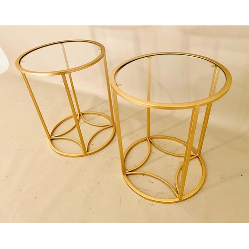 WINE TABLES, pair, 46cm high, 38cm diameter, 1960s French style, glass tops, gilt metal frames. (2)