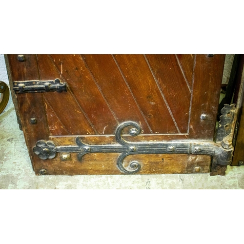 557 - DOORS, each 231cm H x 75cm excluding hinges, a pair, early 20th century stained pine and iron mounte... 