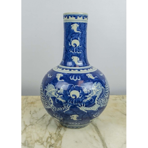 19 - A CHINESE BLUE AND WHITE PORCELAIN BULBOUS VASE, Qing mark to base, decorated with a dragon chasing ... 
