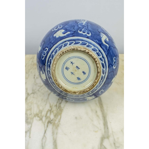 19 - A CHINESE BLUE AND WHITE PORCELAIN BULBOUS VASE, Qing mark to base, decorated with a dragon chasing ... 