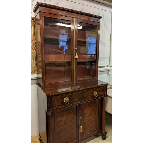 128 - SECRETAIRE BOOKCASE, 195cm H x 94cm W x 47cm D, Regency mahogany and brass inlaid with two glazed do... 