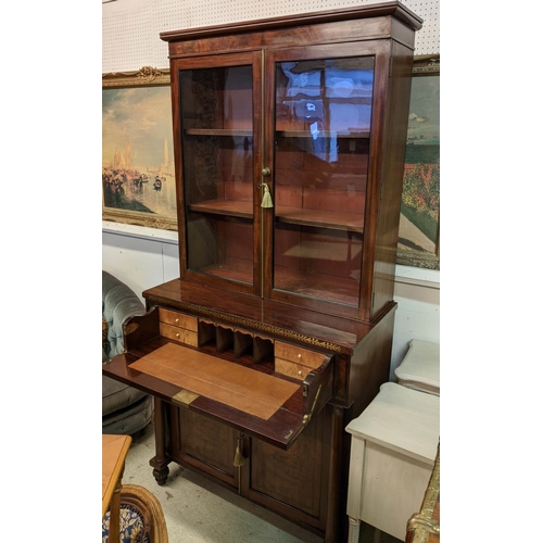 128 - SECRETAIRE BOOKCASE, 195cm H x 94cm W x 47cm D, Regency mahogany and brass inlaid with two glazed do... 