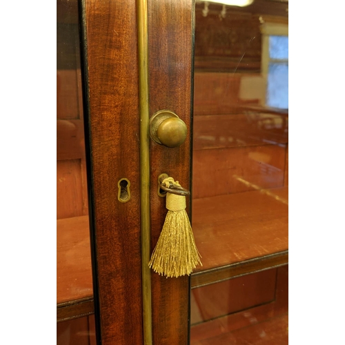 128 - SECRETAIRE BOOKCASE, 195cm H x 94cm W x 47cm D, Regency mahogany and brass inlaid with two glazed do... 