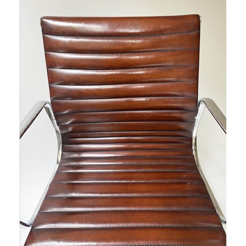 117 - REVOLVING DESK CHAIR, Charles and Ray Eames inspired with ribbed tan leather seat revolving and recl... 